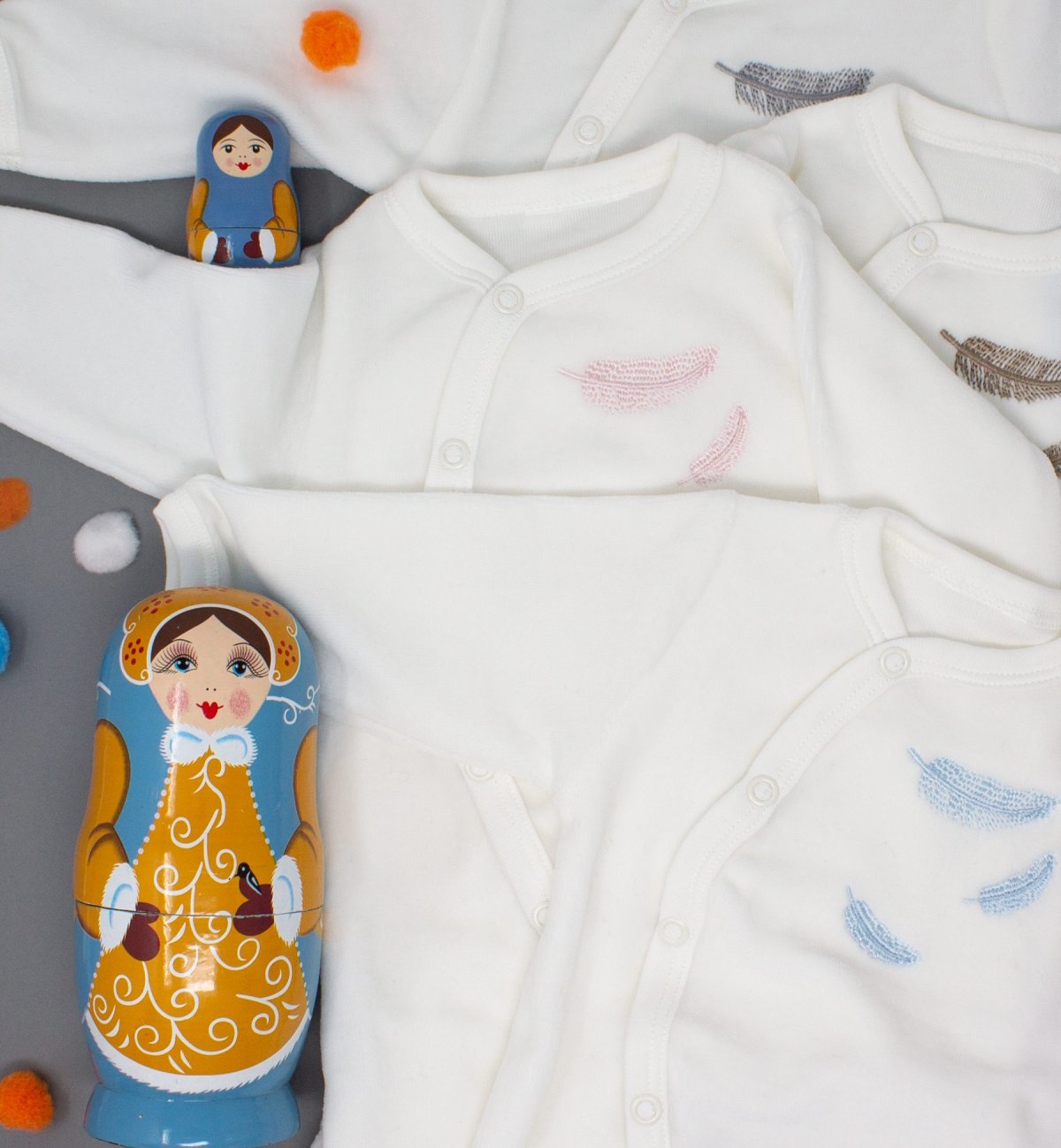 Organic Cotton baby pajamas with colorful embroidered feather patterns