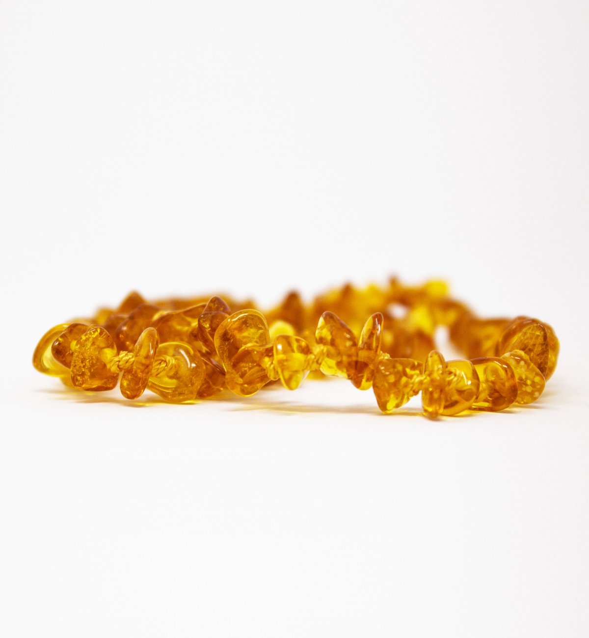 Honey-coloured amber baby necklace with Kadolis safety clasp