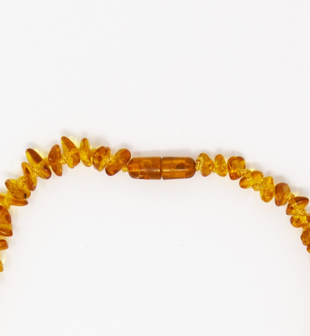 Honey-coloured amber baby necklace with Kadolis safety clasp