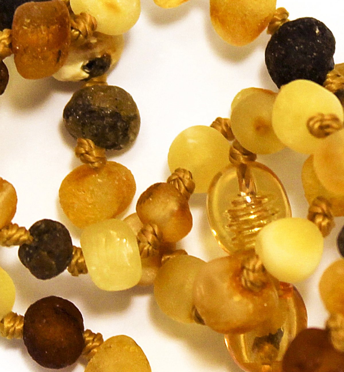 Safety amber necklace for baby with multicolored round pearls Kadolis