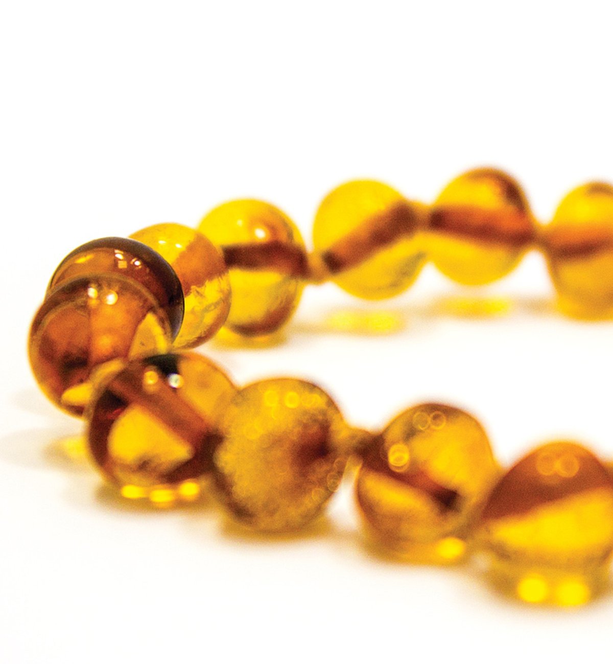 Safety amber bracelet for baby with round honey beads Kadolis